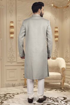 Introducing our latest masterpiece, the Mens Sherwani R14-S65. Made with a delicate pastel color, this sherwani exudes elegance and sophistication. Perfect for special occasions and formal events, this sherwani with unique design make you stand out in the crowd and elevate your style to a whole new level. Elegant Sherwani With Zari Work Straight Kurta, Elegant Sherwani With Zari Work, Luxury Bandhgala For Groom, Classic Sherwani For Wedding And Festive Occasions, Unstitched Elegant Straight Kurta Sherwani, Elegant Unstitched Sherwani With Straight Kurta, Classic Wedding Sherwani For Festive Season, Classic Wedding Sherwani For Festive Occasions, Classic Festive Wedding Sherwani