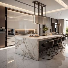 a kitchen with marble counter tops and bar stools next to an island in the middle