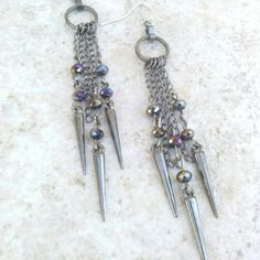 Handmade Set Of Earrings Features Swarovski Midnight Black Crystals Combined With. Chains And Gunmetal Spikes In A Long Dangle Design. Great For Valentine's Day Or As A Gift. *I Personally Created And Designed This Item. I Trully Appreciate Your Support And Likes. Created For My Accessory Line On Etsy.Com For More Of My Unique Designs Visit : Www.Tommybee.Etsy.Com Gunmetal Dangle Earrings Metal Jewelry, Gunmetal Dangle Jewelry, Gunmetal Dangle Earrings, Metal Jewelry With Dangling Beads For Party, Metal Chain Chandelier Earrings, Edgy Dangle Chain Jewelry, Party Jewelry With Dangling Metal Beads, Gunmetal Party Jewelry, Nickel-free Long Drop Chandelier Earrings For Party