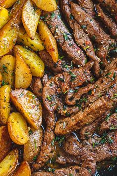 steak and potatoes in a skillet with herbs on top, ready to be eaten