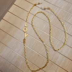 "Beautiful Gold LOVE x Link EyeGlass Chain! Made with gold plated box link chain, letters \"L\", \"O\", \"V\", \"E\",   and gold plated clasps. This chain is approx. 26 inches.  Please let me know if you need a different length and I can customize the length to suit your needs 😊. Includes with each chain are the eyeglass loops that can attach the chain to your eyeglasses or sunglasses." Gold Metal Jewelry With Letter Beads, Metal Glasses Chains As Gift, Metal Glasses Chain With Adjustable Chain As Gift, Adjustable Gold Chain Glasses Chains As A Gift, Adjustable Gold Glasses Chains As Gift, Adjustable Gold Glasses Chains For Gift, Trendy Gold Chain Glasses Chains As Gift, Trendy Gold Chain Glasses Chain For Gift, Trendy Gold Glasses Chains As Gift