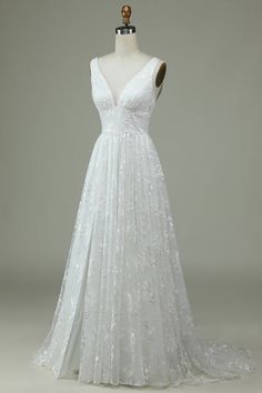 a white wedding dress on a mannequin with an open v - neckline