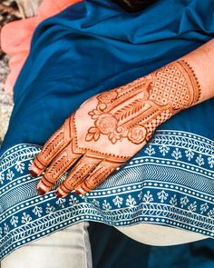 a person with henna on their hand