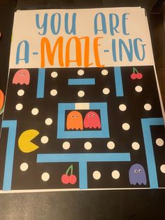 a poster that says, you are a male - ing game with pacman on it