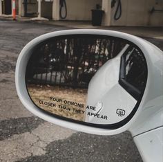 the side mirror of a car with writing on it