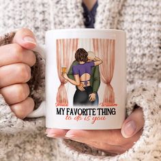 a woman holding a coffee mug with the words my favorite thing to do is go