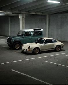 two cars parked in a parking garage next to each other