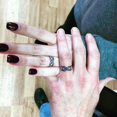 two people with matching rings on their fingers