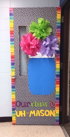 a door decorated with flowers and the words, mom's day in mason jar