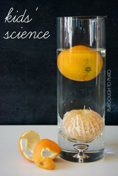 two oranges and one lemon in a glass with water