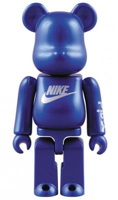 a blue bear toy with the nike logo on it's chest and head is shown