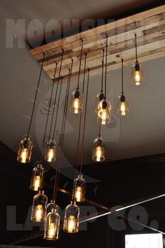 a chandelier made out of mason jars hanging from the ceiling