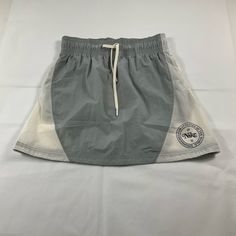 Nike Women's Sportswear Heritage High Waisted Woven Mini Skirt Size S Msrp $58 Casual Stretch Gray Skort, Casual Skort For Streetwear, Casual Cotton Skort For Streetwear, Sporty Stretch Cotton Skirt, Casual Sports Skort With Pockets, Sporty Skirt For Spring Sports, Casual Gray Cotton Skort, Sporty Short Cotton Skirt, Spring Cotton Sports Skort