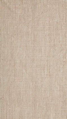 a close up view of a beige fabric texture