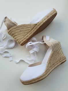 "Lace up, rope sole espadrille PUMP wedges (9cm heels = 3.54 inches) in WHITE, with reinforcement stitching in the front. Antislippery soles covered with rubber. In order to prevent the fraying of the ribbons, the ribbon ends are glued, what makes a quite nice closing (see last pic for details). 🦋 VEGAN SHOES, animal friendly & sustainable. Eco friendly. Jute fiber has excellent insulating properties and low thermal conductivity. It is environmentally friendly, bio-degradable and recyclable. ♻ Lace Up Espadrille Wedges, White Espadrilles, Vegan Sandals, Lace Up Espadrilles, Ribbon Ends, Platform Espadrilles, Bride Shoes, Black Wedges, Vegan Shoes