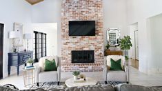 a living room filled with furniture and a fire place