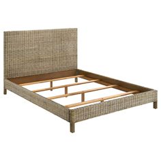 an image of a bed with wicker headboard