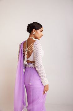 Lilac pearl embellished saree paired with pearl drop full sleeves blouse.From Vvani Vats Jhoomar collection.DELIVERY TIMEPlease allow 8-12 weeks for your outfit to arrive.FABRIC DETAILSBlouse - Georgette, Saree - OrganzaProfessional cleaning only. DISCLAIMERBelts are additional chargeable. Hanging tassel at back is additional chargeable. Designer Long Sleeve Blouse For Party Wear, Designer Long Sleeve Party Wear Blouse Piece, Designer Party Wear Blouse With Pearl Embroidery, Elegant Long Sleeve Choli With Pearl Embroidery, Evening Blouse Piece With Pearl Embroidery In Georgette, Evening Georgette Blouse Piece With Pearl Embroidery, Designer Long Sleeve Choli With Pearl Embroidery, Elegant Long Sleeve Pre-draped Saree With Zari Work, Party Wear Long Sleeve Blouse With Dupatta