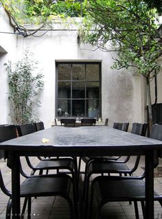 an outdoor table and chairs are set up outside