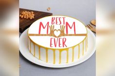 a cake with the words'best mom ever'on it is sitting on a plate