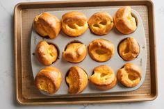 freshly baked bagels on a baking tray ready to be eaten by someone in the kitchen