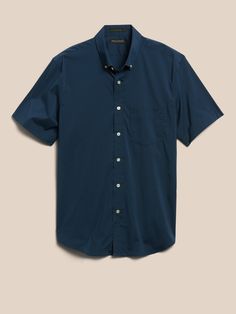 Soft and stretchy, our Tech-Stretch Cotton shirts are breathable, quick-drying, and moisture-wicking so they stay dry and comfortable when things heat up.  Button-down collar.  Chest pocket.  Button front.  Shirttail hem.  Slim fit.  Short sleeves. Functional Short Sleeve Cotton Shirt, Casual Business Shirt, Wrinkle-resistant, Casual Business Shirt With Wrinkle-resistant Fabric, Casual Wrinkle-resistant Shirt For Business Casual, Navy Collared Slim Fit Shirt, Casual Blue Wrinkle-resistant Shirt, Casual Blue Wrinkle-resistant Top, Navy Button-up Casual Shirt, Blue Work Shirt