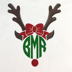 a white t - shirt with reindeer antlers and a monogrammed bow on it