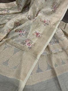 Luxuriously soft pure Chanderi silk by cotton Banarasi dupatta with a floral print. Small zari butas are intricately woven throughout the dupatta, exuding an elegant and timeless charm. Tassels attached. Gold Anarkali With Printed Motifs, Festive Gold Traditional Wear With Printed Motifs, Transitional Chanderi Dupatta With Printed Motifs, Cotton Silk Dupatta With Printed Motifs In Traditional Drape, Cotton Silk Dupatta With Printed Motifs, Designer Silk Dupatta With Printed Motifs, Unstitched Gold Salwar Kameez With Printed Motifs, Transitional Floral Print Dupatta With Traditional Drape, Transitional Floral Print Traditional Dupatta