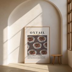 an image of a poster on the wall next to a chair and window with sunlight streaming through it