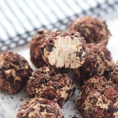 chocolate and coconut truffles on a white plate