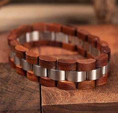 Product Description This unique design wood bracelet features real (Reclaimed) zebra wood with metal accents which results in a stunning, one of a kind, lightweight men’s bracelet. Each wood bracelet is naturally alluring and hand crafted without the use of harsh chemicals. Dimensions: Perimeter: 7.4" (188 mm) Band Width: 0.6" (15.5 mm) Item Weight: 1.4 oz (39 g) Product Specifications Bracelets Type: Chain & Link BraceletsMetals Type: Stainless SteelClasp Type: Hidden-safety-claspStyle: Cla Natural Wood Bracelet Jewelry Gift, Natural Wood Bracelet As A Gift, Natural Wood Bracelet, Mens Bangles, Wooden Jewellery, S Bracelet, Wooden Bangle, Wooden Bracelet, Wood Bracelet