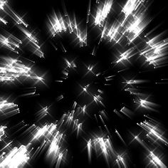 an abstract black and white photo with light streaks in the center, taken from above