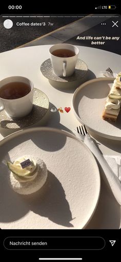 three plates with desserts on them and two cups of tea next to each other