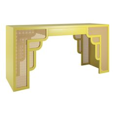 a yellow desk with an intricate design on the top and bottom, against a white background