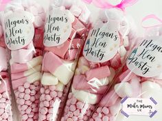 pink and white marshmallows in cellophane bags with labels on them