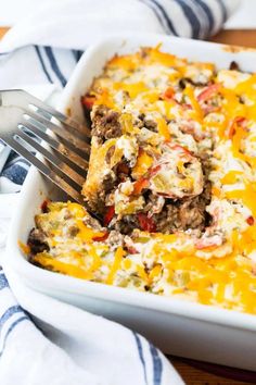 a casserole dish with meat, cheese and vegetables