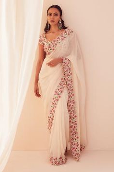 Ivory pre-pleated saree with floral embroidery and cutdana work on the border. Comes with a blouse.
Component: 2
Pattern: Embroidery
Type Of Work: 3D applique, Beads and Stones
Neckline: Scoop
Sleeve Type: Cap
Fabric: Georgette, Shantoon and Modal
Color: White
Other Details: 
Occasion: Destination Wedding - Aza Fashions Ivory Saree, 3d Applique, Pleated Saree, Draped Saree, Embroidery 3d, Floral Saree, Indian Saree Blouse, Indian Saree Blouses Designs, White Saree