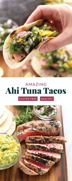 a person holding a taco in their hand with other food on the table behind it