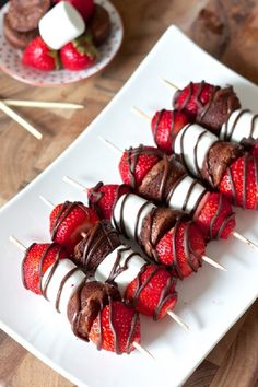 chocolate covered strawberries on skewers with marshmallows