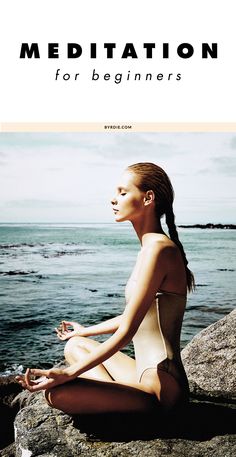 a woman in a bodysuit meditates on the rocks by the water with her eyes closed