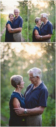 an older couple embracing each other in front of some trees and grass with the sun shining on them