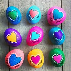 painted rocks with words and hearts on them