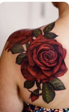 a woman with a rose tattoo on her shoulder