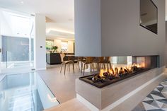 a modern fireplace in the middle of a living room