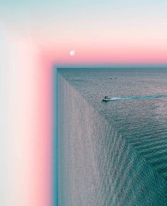 a boat floating in the middle of an ocean next to a wall with a pink and blue sky