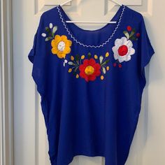 Gorgeous And Vibrant Blouse With Beautiful Stitching And Flower Detail. Nwot Blue Short Sleeve Blouse For Vacation, Blue Floral Embroidery Blouse For Summer, Blue Floral Embroidered Summer Blouse, Blue Floral Embroidery Beach Tops, Bohemian Short Sleeve Blue Blouse, Bohemian Blue Short Sleeve Blouse, Blue Floral Embroidery Top For Vacation, Embroidered Blue Blouse For Vacation, Blue Embroidered Top For Vacation