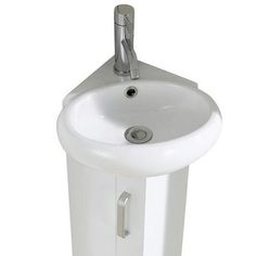 a white pedestal sink with a chrome faucet and drain on the side, in front of a white background