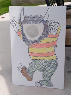 a drawing of a monster on a white board