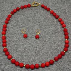 "Beaded Gemstone Necklace Description: *Natural Gemstone Beads: Red Coral (10mm round) *Approximate Length: 21\" *Clasp: Gold Toggle *Coordinating Earrings Included *Free Domestic Shipping - Arrives in Gift Box - Gift Wrapping Available The beaded necklace is handmade custom designed using precious natural gemstones artistically designed into the unique one of a kind statement necklace. This is the exact necklace you will receive when purchased. Each necklace is handmade by me from inception to Red Beaded Necklaces With Natural Stones, Red Coral Jewelry With Natural Stones In Round Beads, Red Jewelry With Faceted Beads, Red Coral Jewelry With 8mm Beads, Elegant Red Coral Round Bead Necklace, Handmade Adjustable Red Coral Necklace, Red Coral Beaded Round Necklace, Red Polished Beads Round Jewelry, Multi-strand Red Coral Beaded Necklace For Gift