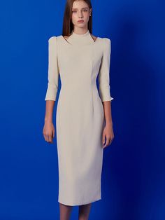 This is a modern and feminine dress by IvanaHelsinki that is made out of high quality and sturdy material. With distinctive mood of the design and comfortable wear, you can style it for your modern daily outfit.- Light high density wool like fabric- H line silhouette- Layered design and slim waist Elegant Fitted Midi Dress For Winter, Formal Fitted Beige Midi Dress, Beige Midi Dress For Fall Evening, Fitted Beige Midi Dress For Semi-formal Occasions, Semi-formal Fitted Beige Midi Dress, Elegant Beige Midi Dress For Winter, Fitted Knee-length Wool Dress, Modern Structured Midi Dress, Fitted Dressy Midi Dress For Winter